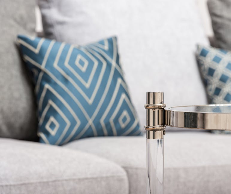 A contemporary living room scene featuring stylish decorative cushions with geometric patterns.